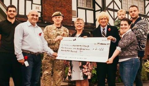 The cheque is handed over the the Mercian Regiment Benevolent Fund