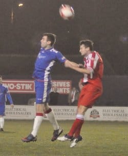 Richard Davies battles for the ball in the air. Pic: Pamela Mullins