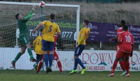 Nick Wellecomme's effort is well saved. Pic: Dave Birt