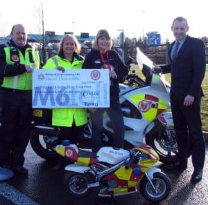 Blook Bikes Rider Nigel Bundy, with Karen Johnstone from Midland Expressway Ltd, Helen Bundy from Blood Bikes and James Hodson, the chairman of Midland Expressway Ltd's social committee