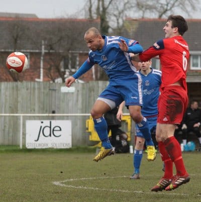 Simon Brown clears the danger. Pic: Dave Birt