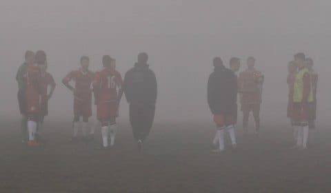 Chasetown's players look on as the fog closes in