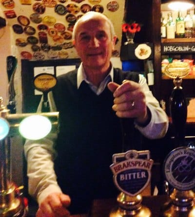 UKIP's John Rackham behind the bar at his pub, the Kings Head in Lichfield