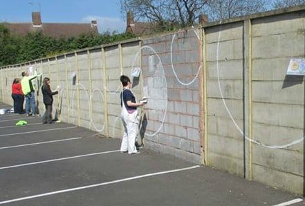 Untitled Art Collective preparing the wall for the new mural in Lichfield. Pic: Lichwheeld