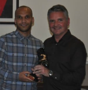 Simon Brown collects an award from Charlie Blakemore