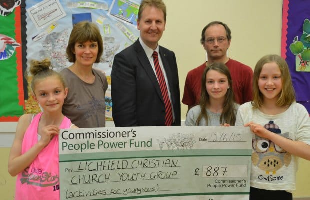 Matthew Ellis with Sarah and Jeff Fry, leaders of Lichfield Christian Church Youth Group and some of the children who attend