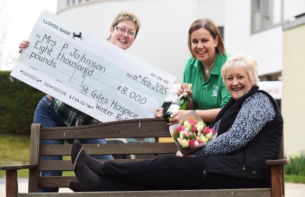 Lesley Holmes (Lottery Development Manager, St Giles Hospice), Alison Jerram (Lottery Manager, St Giles Hospice) and previous raffle winner Jane Johnson