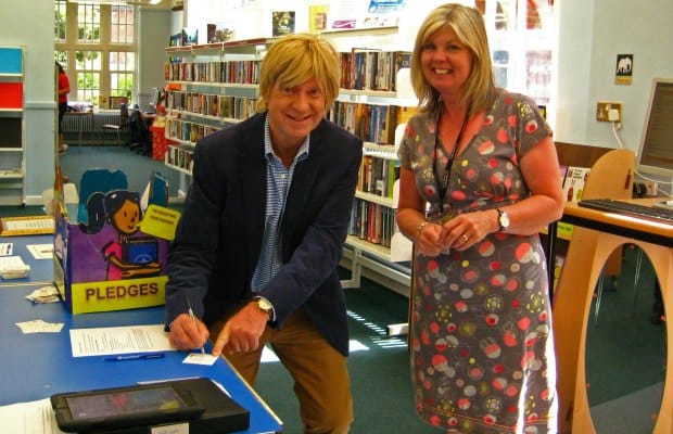 Michael Fabricant signing his pledge card along with Yvonne Smith, Lichfield Library’s Development Officer