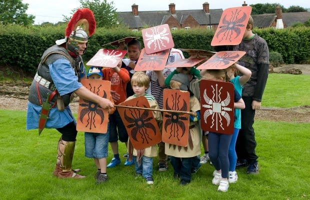 Young visitors learning how to be a Roman soldier