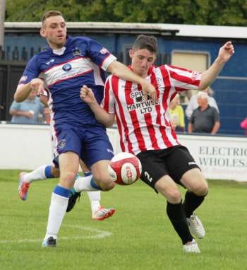 Richard Davies tries to beat his man to the ball. Pic: Dave Birt