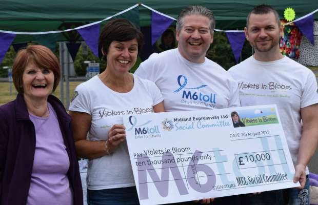 Janet Cox, Kerry Mornington, Andy Pearson and Ivan Mornington with the Violets in Bloom cheque