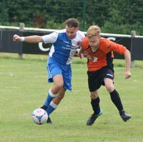 Tom Evans battles for the ball. Pic: Mick Tyler
