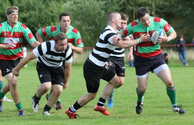 Danny Duggan hands off a defender. Pic: Joanne Gough
