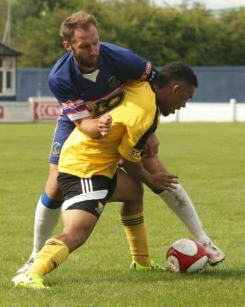 Chris Slater battles for the ball. Pic: Dave Birt