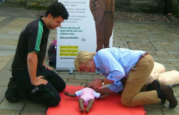 Michael Fabricant MP learning how to give CPR to a baby