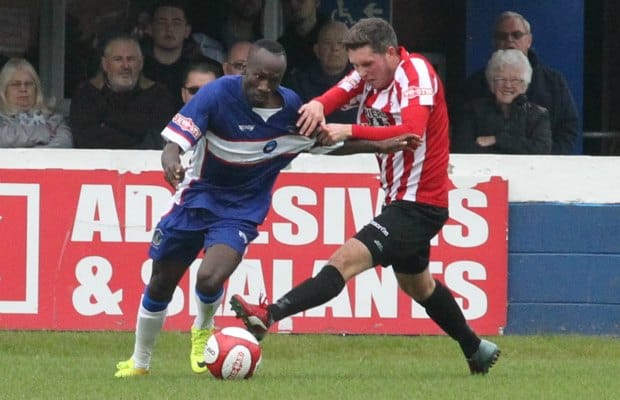 Stan Mugisha has his shirt tugged. Pic: Dave Birt