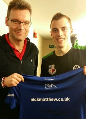 James Roberts receives a signed shirt from Nick Matthew