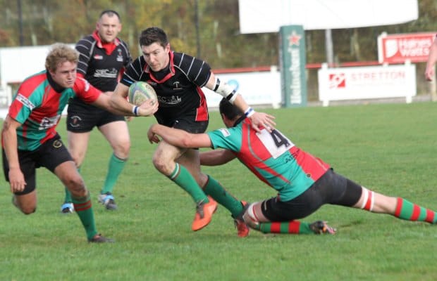 Ben Holt tries to burst through a tackle. Pic: Joanne Gough