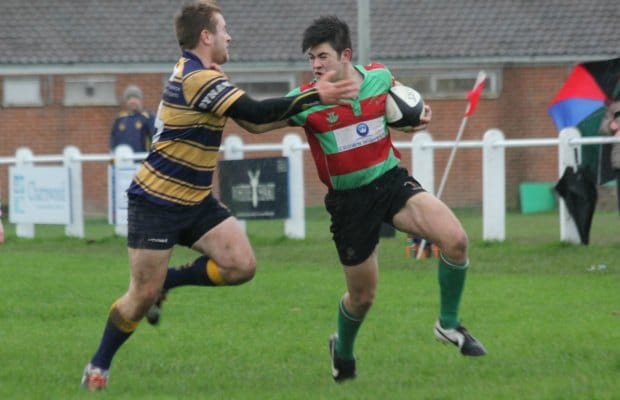 Owen Rookyard tries to hand off a tackler. Pic: Joanne Gough