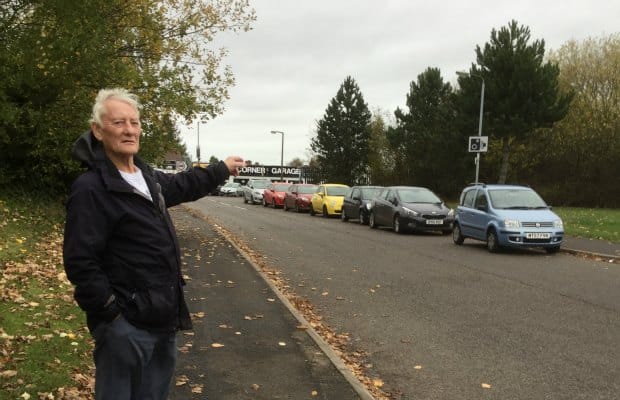 Councillor Eric Drinkwater with some of the parked cars on Ring Road in Burntwood
