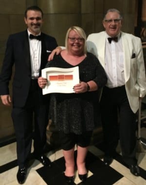 Grangemoor Working Men's Club treasurer Darren Ennis with secretary Mandi Edwards and trustee David Crowe at the awards ceremony
