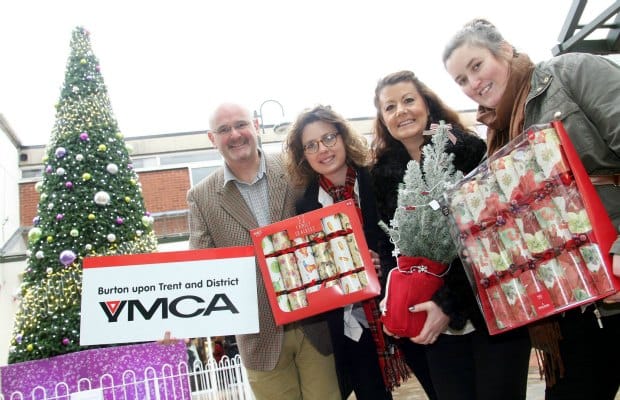 Three Spires Shopping Centre manager Lisa Prokopiou with Andy Horsnail, Emily Sendell and Natasha Aishford of the YMCA launching their Christmas present campaign in Lichfield