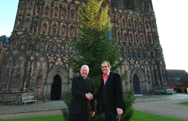 The Very Revd Adrian Dorber, Dean of Lichfield, and Simon Price, CEO of Arthur Price, in front of the Cathedral Christmas tree