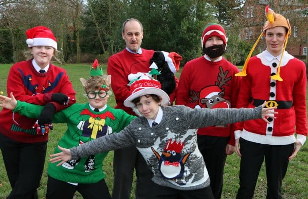 Niamh Padley, Harry Baller, Head Teacher Dr Daryl Brown, school dog Lucy, George Patterson, Joe Cahilland Jacob Morgan in their Christmas jumpers
