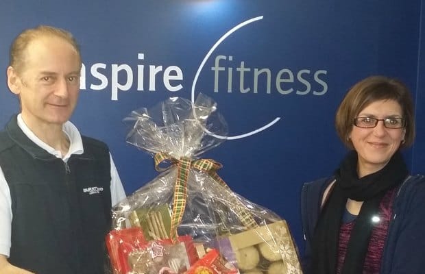 Mark Adams hands over the hamper to Lisa Chmielewska