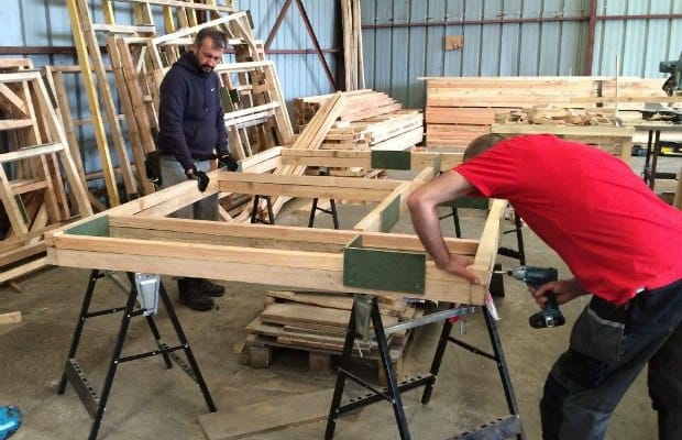 Flat pack buildings being put together by volunteers. Pic: Dave Simcox