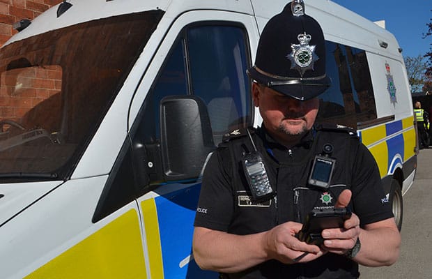Sgt Tyrone Kerr with one of the new mobile devices issued to officers in Staffordshire