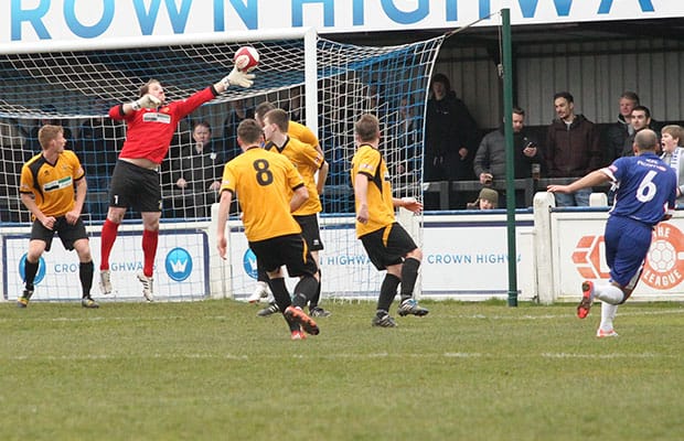 Simon Brown's shot is palmed onto the bar by Chris Martin. Pic: Dave Birt