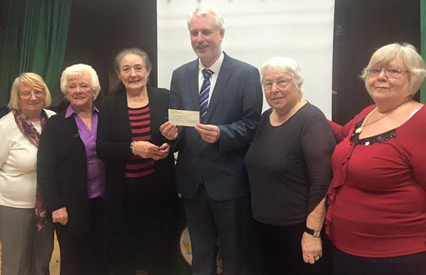 Members of Chasetown Women's Guild hand over their fundraising cheque