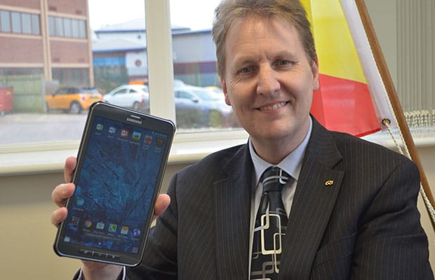 Matthew Ellis with one of the Samsung Galaxy tablets