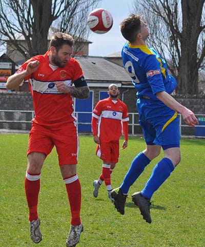 Chris Slater battles for the ball in the air. Pic: Pamela Mullins