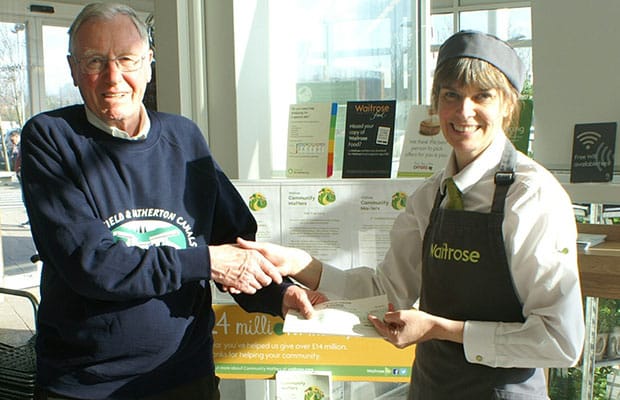 Lichfield and Hatherton Canals Restoration Trust chairman David Dixon receives a cheque from Waitrose's Sarah Fry