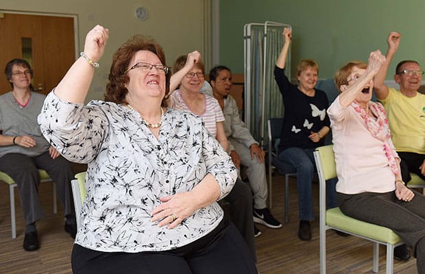 Pat Mason taking part in the seated exercise class at St Giles Hospice