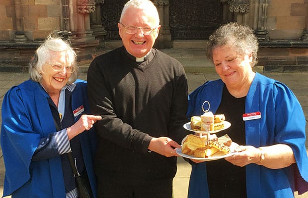 The Very Revd Adrian Dorber, Dean of Lichfield, and two welcomers from the cathedral getting ready for Staffordshire Day