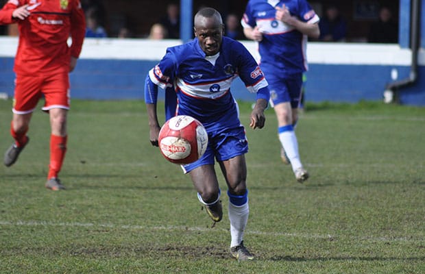 Stan Mugisha drives forward with the ball. Pic: Pamela Mullins