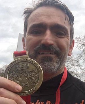 Cllr Darren Ennis with his London Marathon medal