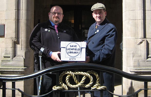Lichfield and Burntwood Green Party members Adam Elsdon and Simon Partridge handing in the Save Lichfield Library petition at the County Buildings in Stafford