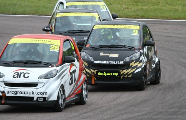 Greg Owens tries to find a way past Alan Palmer. Pic: MotorV8 Media