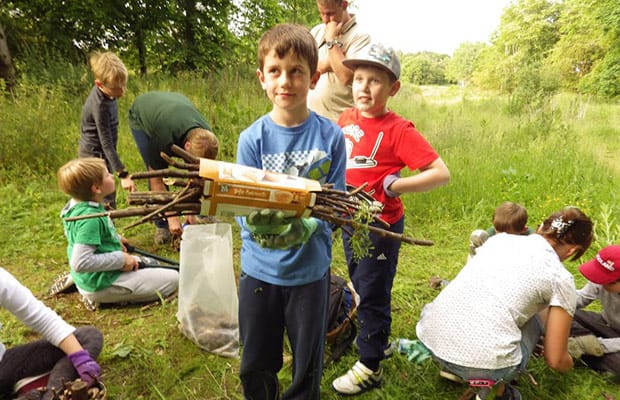 Scouts building a bug hotel on the route of the Lichfield Canal