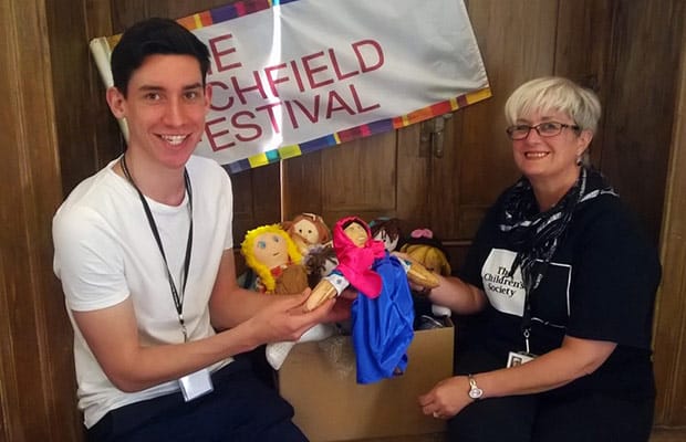 Rory Payne handing over ragdolls to Jenny Crosby from The Children’s Society