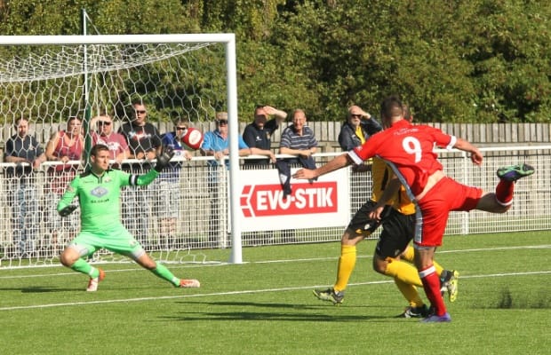 Mitch Piggon fires past Saul Deeney in the Basford goal. Pic: Dave Birt