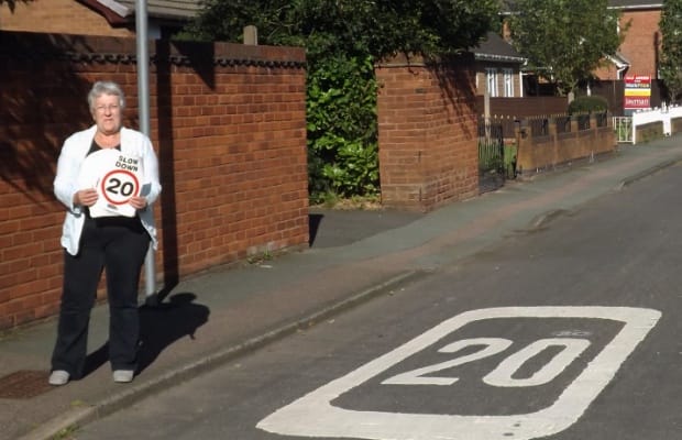 Cllr Sue Woodward with the new 20mph stickers