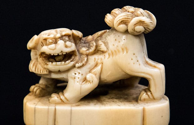An 18th Century miniature ivory Foo dog on a plinth which sold for £350 at auction