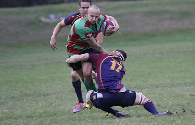 Dan Garriety tries to brush off a tackle. Pic: Joanne Gough