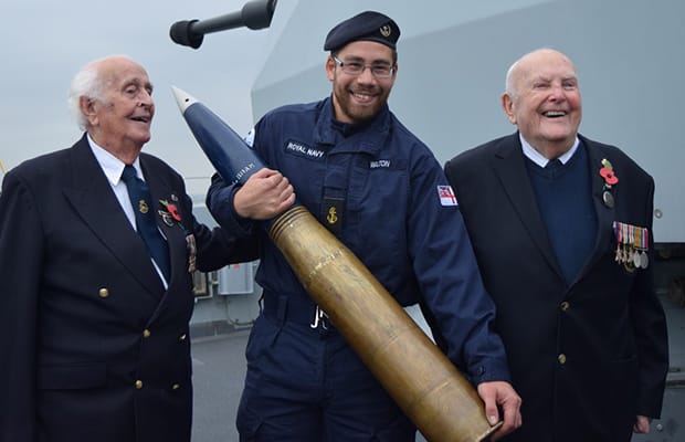 Norman Burns and Alfie Booker with a member of the HMS Westminster crew