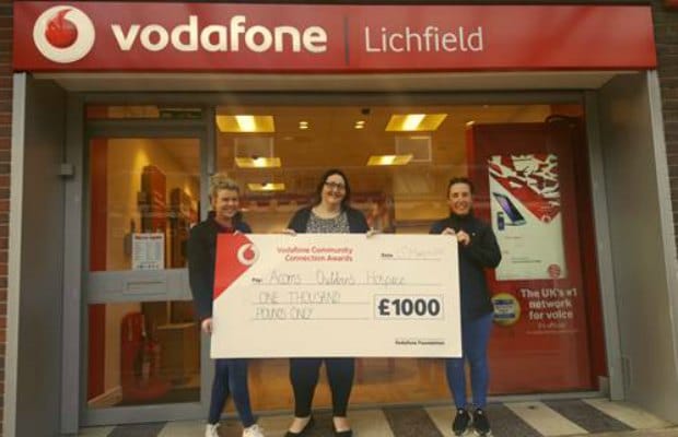 The cheque is presented outside the Lichfield branch of Vodafone